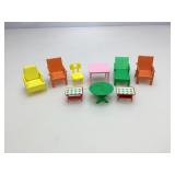 Assorted plastic doll furniture.