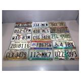 15 assorted metal vehicle license plates.