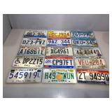 15 assorted metal vehicle license plates.