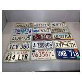 15 assorted metal vehicle license plates.