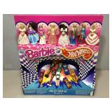 Barbie or Hot wheels Happy meal toy display.