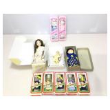 Assorted porcelain dolls.