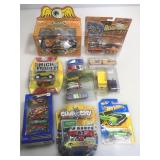 Assorted die cast cars and more.