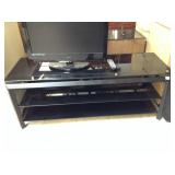 Black glass top tv stand - approx. 4 ft long