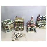 Lighted handpainted porcelain village Pieces.