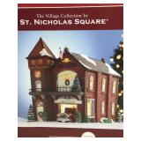 Illuminated St Nicholas Square village piece.