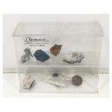 Display shelf with assorted rock specimens.