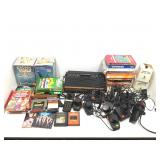 Atari gaming system with accessories and more.