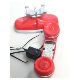 Cordless red landline phone.