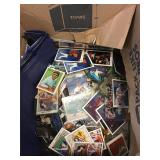 Box full of sports cards unsorted