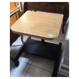 Rolling adjustable height table