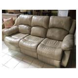 Cream recliner w/one small hole