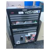 Toolbox with various tattoo supplies - needles,