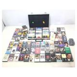 Cassette carry case and Assorted tapes. Music and