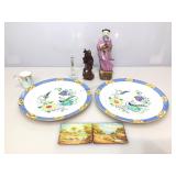 Asian style figures and collectible plates.