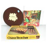 Chess teacher in box and puzzles. In box.