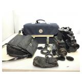 Vintage video cameras in carry bags.