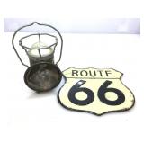 Route 66 metal sign and delta powerlight lantern.