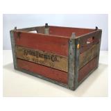 Arden farms wooden crate with metal bottom.
