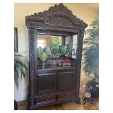 Carved wood bar with marble and glass shelves