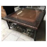 Glass top coffee table w/metal elephant accents