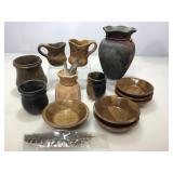 Assorted pottery. Vases, cups and more.