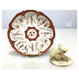 Imperial collectible plate and stone figure.