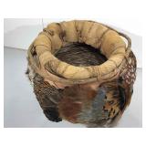 Hand crafted basket with real feathers.