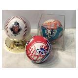 3 painted baseballs