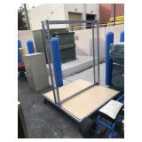 Rolling metal display platform - has slots for