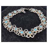 Sterling bracelet with blue stones. 6 In
