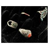 Four sterling rings. Sizes 7, and 4