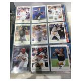 Large album of mixed sports cards