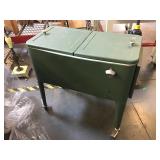 Green rolling cooler, (index side its dent and it