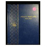 17-Silver Peace dollars in book