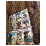 Box of sports cards in pages