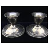 Two sterling weighted candle sticks