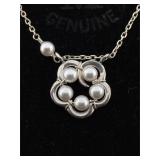 Sterling necklace with flower design pendant. 19