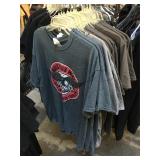 Assorted shirts all with security tags, all