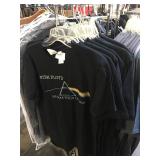 Assorted shirts all with security tags, all