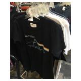 Assorted shirts all with security tags, all