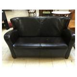 Black loveseat. 4 feet long approx