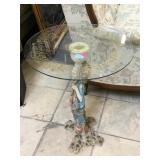 Glass side table with resin statue base
