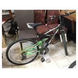 Green mountain bike with some shaman components,