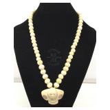 Ivory Netsuke on Beaded Bone Necklace.