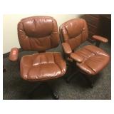 Brown rolling office chairs.