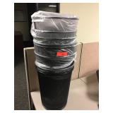 Stack of metal trash bins.