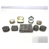 Collection of lidded trinket boxes and more.