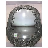 Oval mirror with metal frame. 34x24.