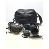 Canon cameras with carry bag and accessories.